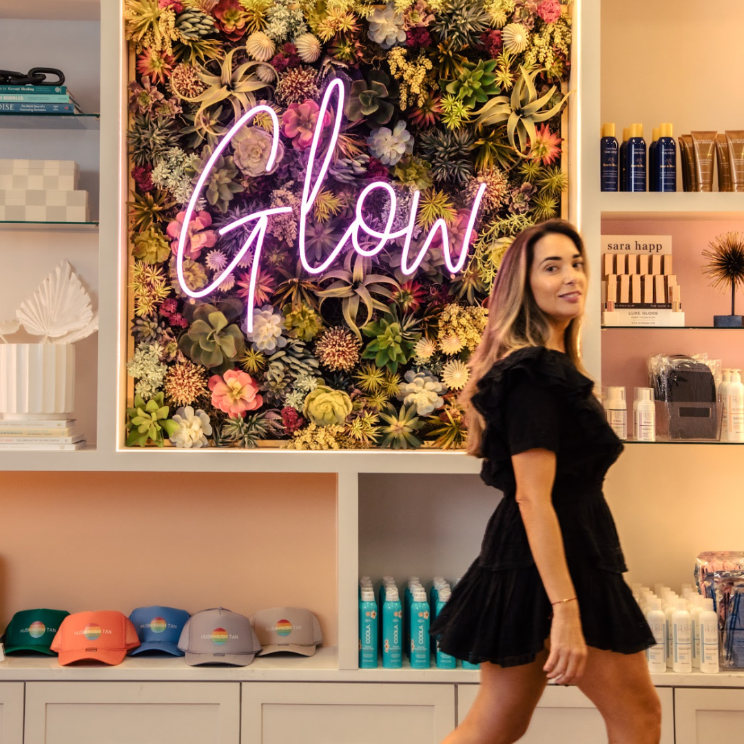 Hush Hush Tan team at the studio glow wall